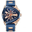Luxury watch with blue strap and rose gold casing on a white background